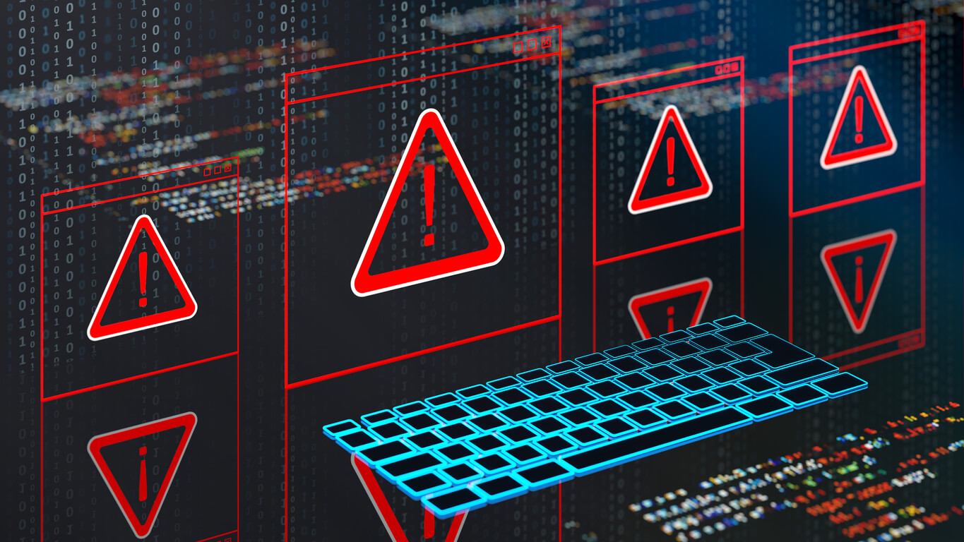 Malware warning icons with a computer keyboard.