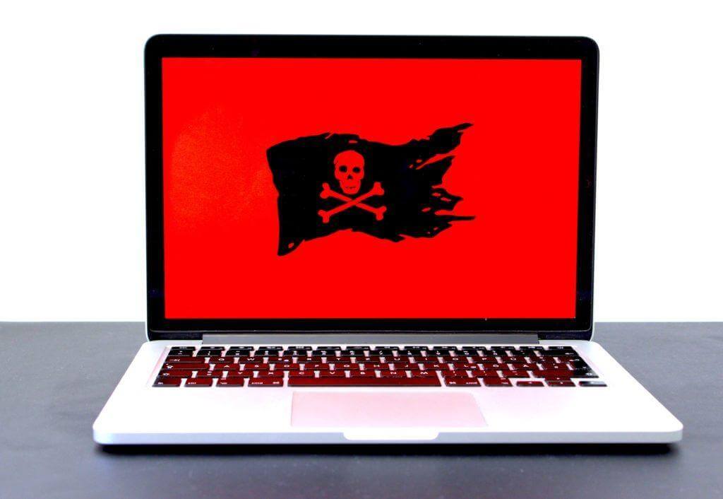 Pirate flag with red background on laptop.