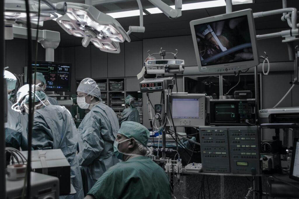 Doctors and nurses working together in an operating room.